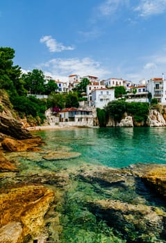 Old town view of Skiathos island, Sporades, Greece. Greek traditional architecture and aegean sea. Popular summer holiday destination scene.