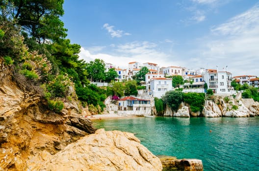 Old town view of Skiathos island, Sporades, Greece. Greek traditional architecture and aegean sea. Popular summer holiday destination scene.