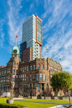 Rotterdam, Wilhelminapier, Netherlands, September 2019: View on the famous Hotel New York with Montevideo tower rising up in the background.