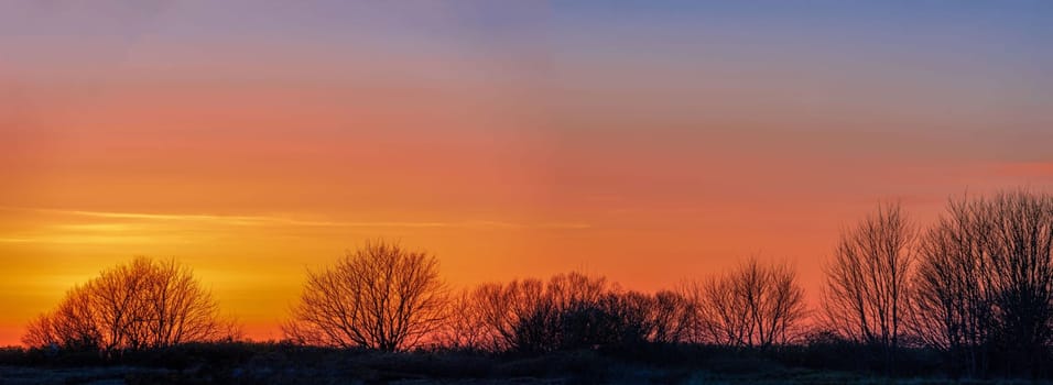 Ines Rügen Panoramic view of the orange sunset on the beach of the northwest peninsula Wittow of Rügen at the Baltic Sea.