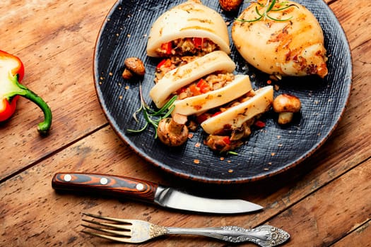Baked stuffed squids with mushrooms. Stuffed calamari.