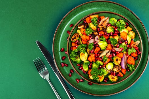 Bright dietary vegetable salad of cabbage, herbs and physalis. Healthy eating