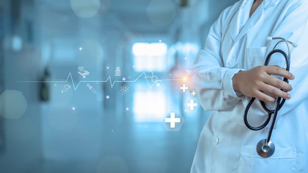 Medicine doctor with stethoscope in hand on hospital background. Medical technology. Healthcare and Medical concept.
