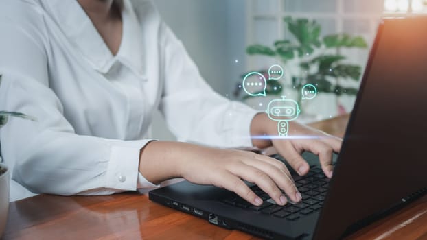 Business woman are working and bringing AI to help them work on computers. Chat with Ai. Chat bot .