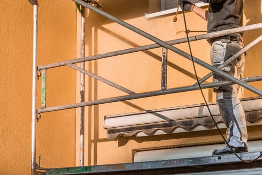 House front washing, cleaning with high-pressure water blaster