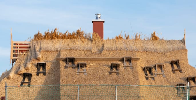 Re-thatching of thatched roofs in Drankse, Baltic Sea, Island of Rügen