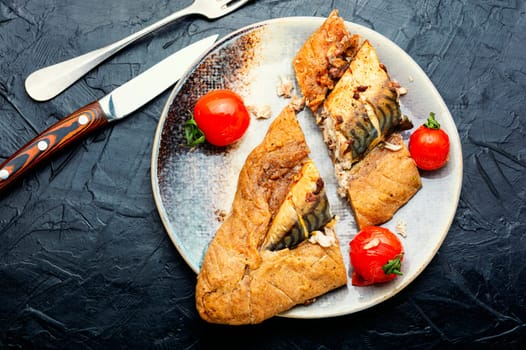 Appetizer fish pie with scomber or mackerel on a concrete kitchen table. Top view
