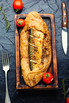 Appetizer fish pie with scomber or mackerel on a concrete kitchen table. Top view