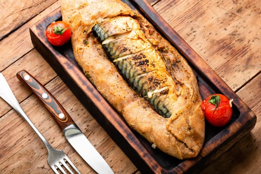 Appetizer fish pie with scomber or mackerel on a concrete kitchen table. Top view