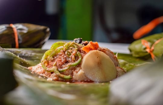 Close-up of the raw ingredients of the Nicaraguan nacatamal on banana leaves. Raw ingredients for the preparation of the traditional Nacatamal, Nacatamal ingredients on banana leaves