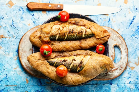 Appetizer fish pie with scomber or mackerel on a concrete kitchen table. Top view