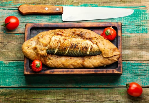 Appetizer fish pie with scomber or mackerel on a concrete kitchen table. Top view
