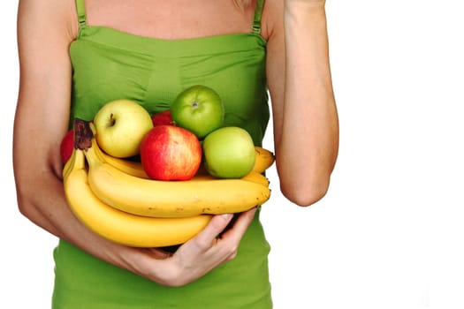 woman holds a pile of fruit on a white background