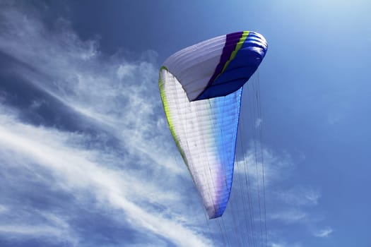 A paraglider against the sky. The sail of a paraglider