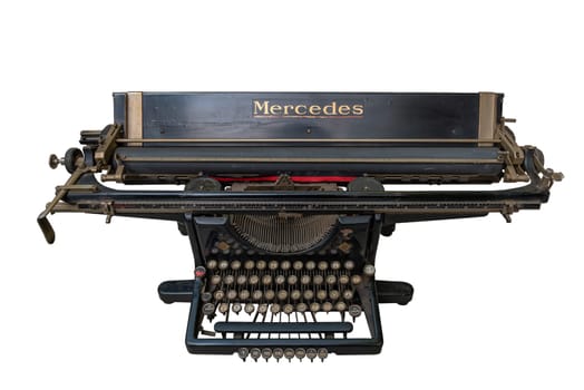 Vintage mechanical typewriter from the past isolated against a white background