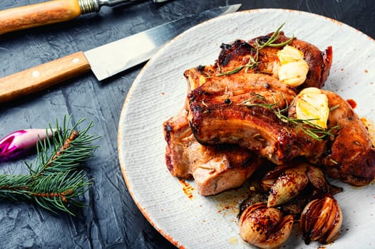 Delicious meat steak in the Christmas. Meat dish on New Year's festive table.