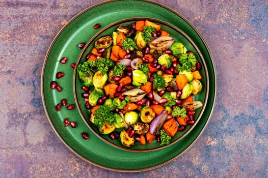 Delicious vegetable salad of boiled brussels sprouts, herbs and physalis. Vegan salad. Top view