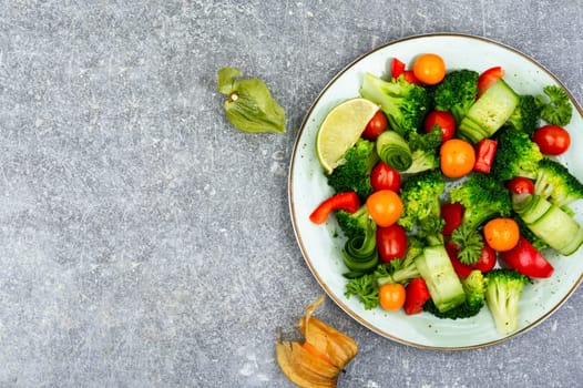 Delicious vegetable salad of boiled brussels sprouts, herbs and physalis.