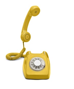 Old yellow rotary phone hook and ready to talk