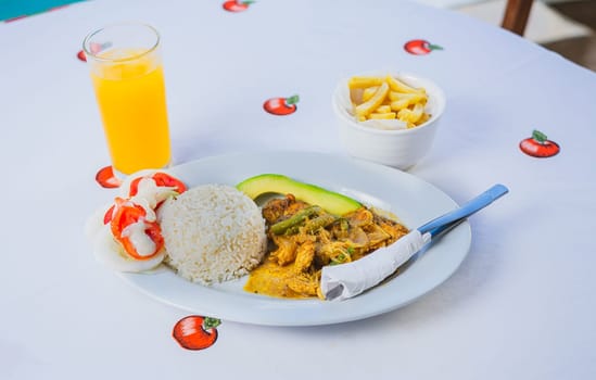 Top view of a traditional breakfast served on the table. Traditional breakfast with orange juice served on the table