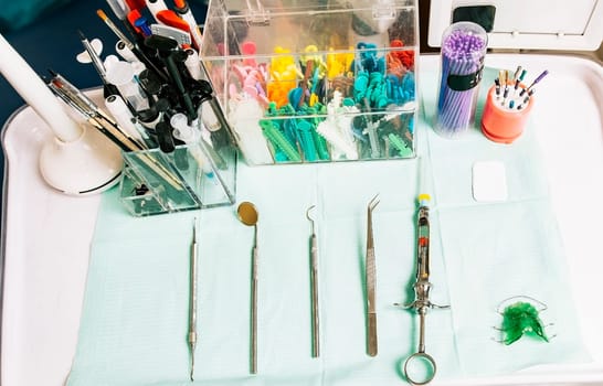 Dentist tools on the table. Top view of stomatologist tools on table. Set of dental tools on dentist's panel. Close up of dental tools on dentist table