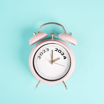 New year 2024 is loading, calendar date on an alarm clock, end of the year, changing time