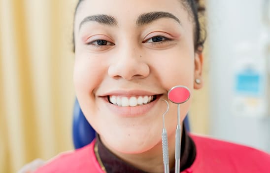 Dental smile young woman with dentist tools. Patient with perfect smile with dental explorer and mirror, Perfect smile of woman with dentist tools, Concept of perfect smile and dental health
