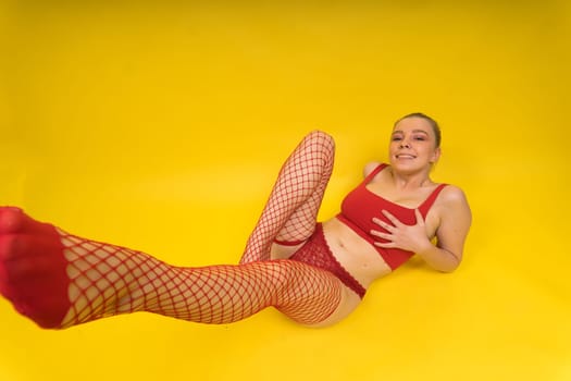 Fashion portrait of young beautiful woman with big breasts. Carefree model in lingerie.