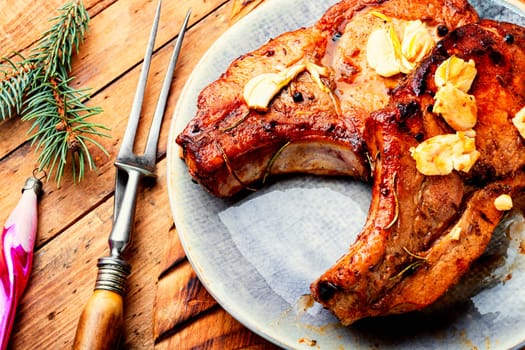 Delicious meat steak in the Christmas table. Meat dish and Christmas decorations.