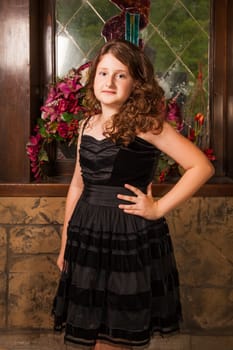 Portrait of a 10 year old girl posing in a castle.