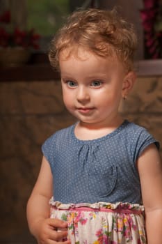 Portrait of 1 year old baby girl in a castle.