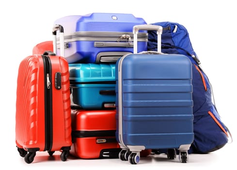 Luggage consisting of large suitcases and rucksacks isolated on white.
