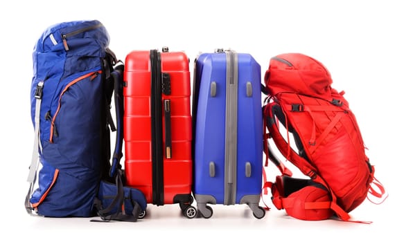 Luggage consisting of large suitcases and rucksacks isolated on white.