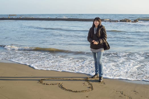 A portrait of a nice girl to the seaside in winter