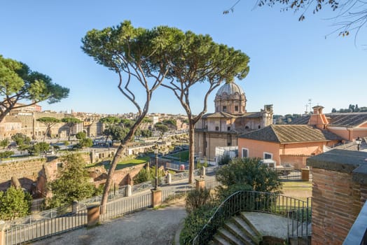 Ruins buildings and statue in the foro romano in Rome italy