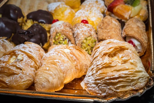 colorful pastries with fruits, cream and chocolate, the real Italian confectionery