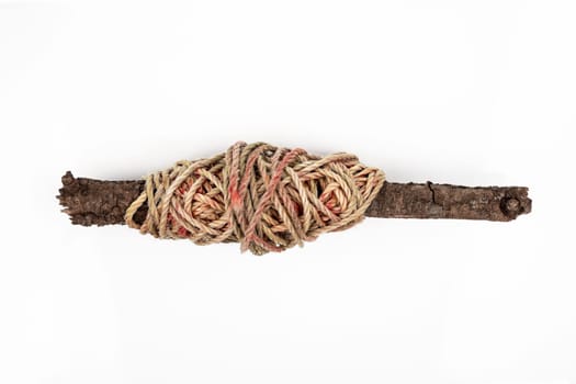 Cord coiled on a piece of wood isolated over white background