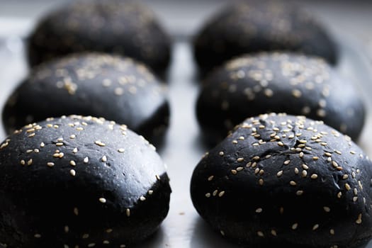 close up of a tray of charcoal buns