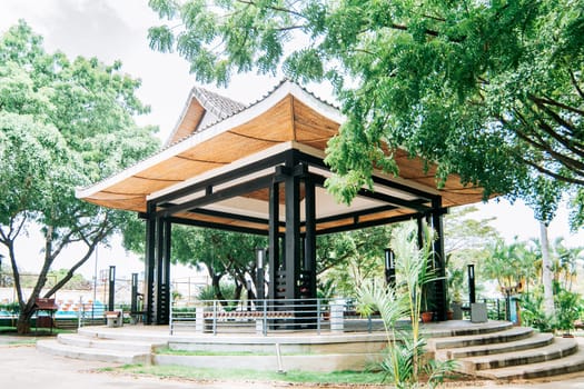 A Chinese-style kiosk surrounded by trees, A park with a Japanese-style kiosk, concept of a small Japanese temple
