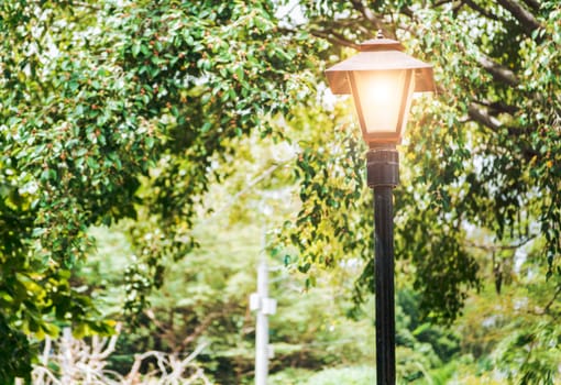 A lantern pole in a square with copy space, An illuminated lantern pole, Public lantern pole, Public lighting pole