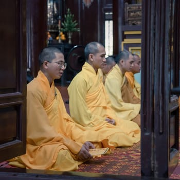 Hue, Vietnam, November 17, 2022: Buddhist monks chanting in Thien Mu Temple in Hue, Central Vietnam
