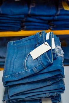 Close up of blue jeans on others with copy space  Various jeans on others with space for text
