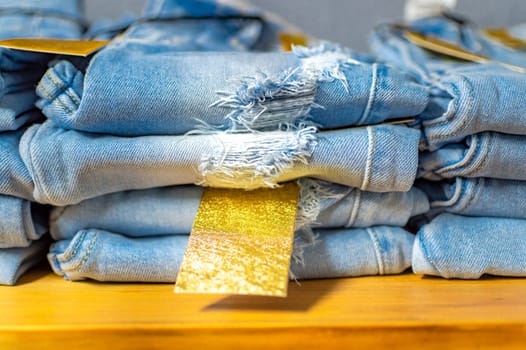Close up of blue jeans on others with copy space  Various jeans on others with space for text