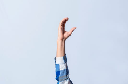 Hand gesturing the letter C in sign language on isolated background. Man hand gesturing letter C of alphabet isolated. Letters of the alphabet in sign language