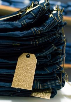 Close up of blue jeans on others with copy space, Various jeans on others with space for text, Clothes sale concept