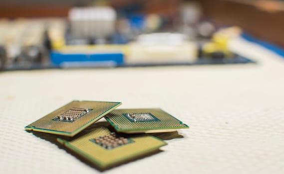 Computer microprocessors, three computer processors with one computer motherboard, computer processor concept