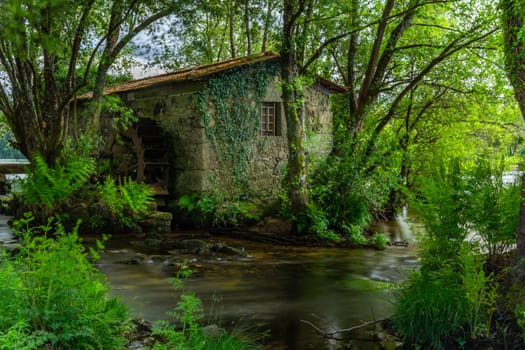 Long exposure near an ancient watermill in Cavado river, Braga, Portugal