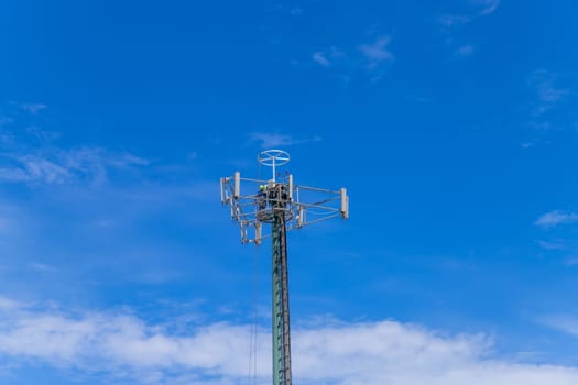 Fatima, Portugal: 30 April 2023: Working at a cellphone antenna tower for maintaining. technician worker repair telecommunication tower. Fatima, Portugal