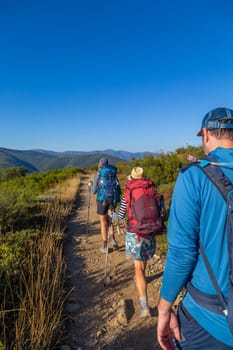 Navarre, Spain, 26 August, 2022: Pilgrims walk along the Camino De Santiago, the Way of St. James pilgrimage route, Navarra, Spain.