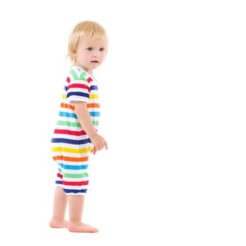 Full length portrait of thoughtful baby in swimsuit